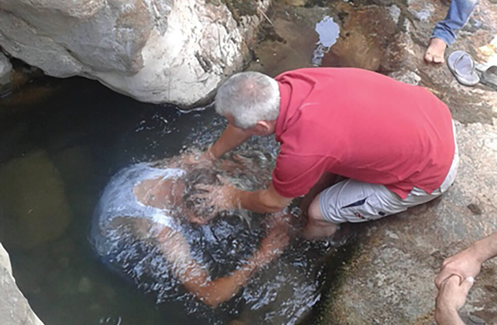 Berber Christians in Algeria Share Christ with Muslim Oppressors A man baptizing another man in the river