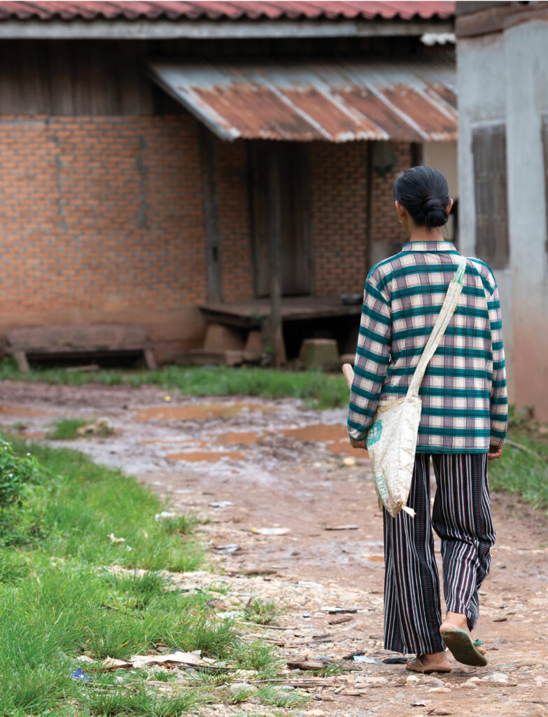 Woman walking toward a house