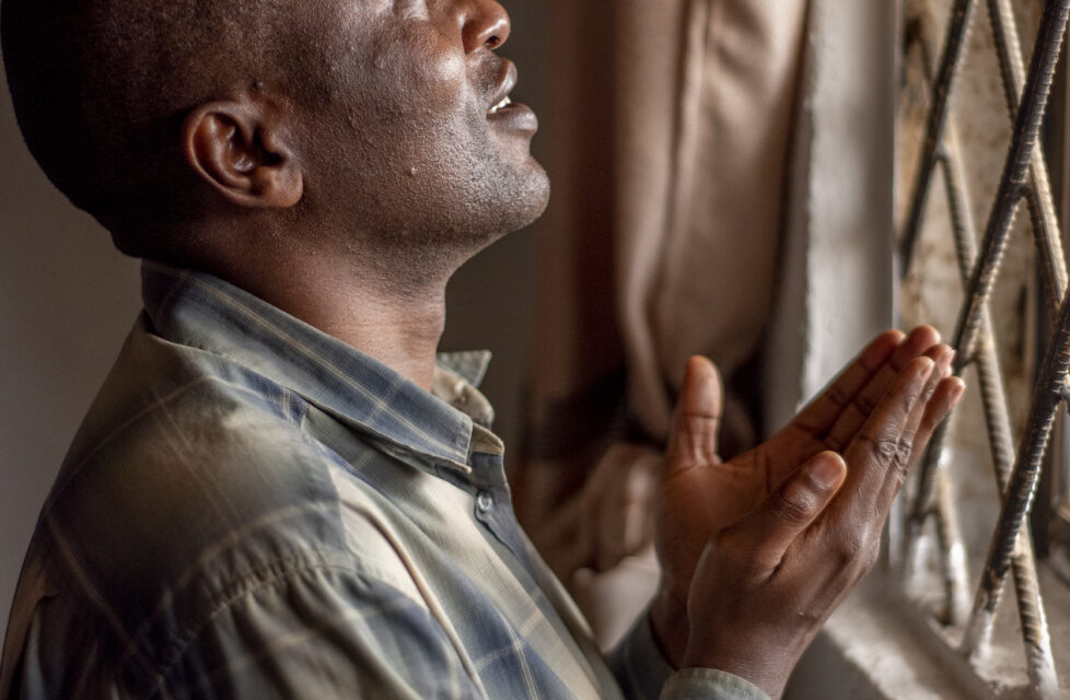 Nigerian Man Loses Eyesight In Attack, But Gains Jesus Nigerian Man Praying at a window