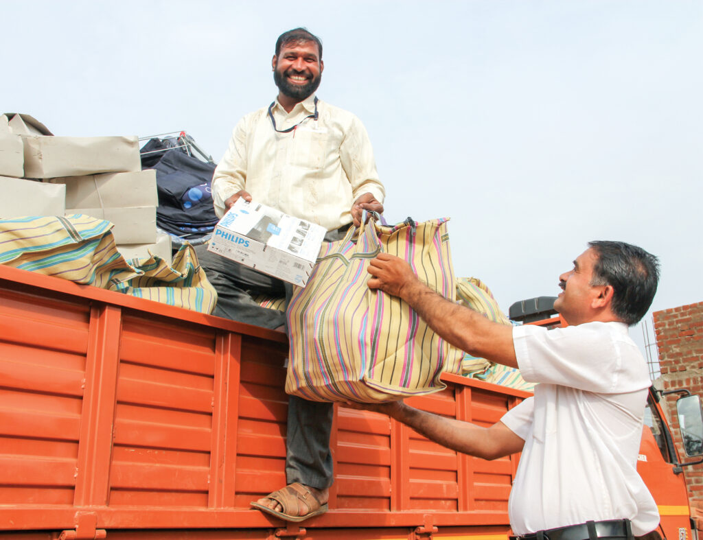 Two men getting supplies for their village
