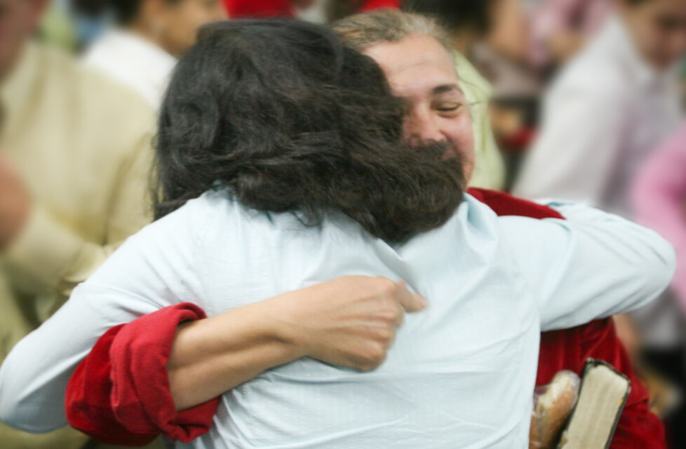 Two Women hugging at a church service