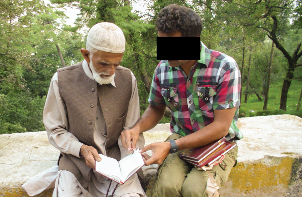 Pakistani Believer Evangelizes to Muslims He Formerly Hated A young man sits and shares the gospel with an older man